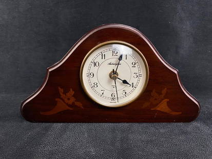 Archangelus Mantle Clock Made in Spain: Archangelus Mantle Clock Made in Spain Quartz movement mantle clock by Archangelus made in Spain. Has a wooden body that appears to be walnut or a similar hardwood. Approximate size: 10" x 5.5" x