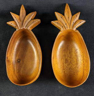 Monkey Pod Pineapple Bowls Two Wooden Bowls: Monkey Pod Pineapple Bowls Two Wooden Bowls This lot has two Monkey Pod pineapple-shaped bowls. These are in good condition with no known damage. They have small engravings on the back. These are