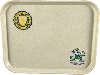 University Of Notre Dame Cafeteria Tray: Here is a fiberglass serving tray that was used at the University Of Notre Dame Cafeteria from the University Food Services. The white tray shows both the Notre Dame Leprechaun Mascot and the Notre