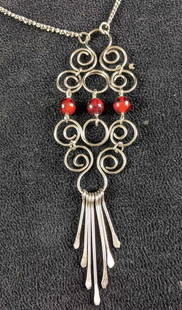 Necklace Wire Wrap Necklace Pendant and Necklace: Necklace Wire Wrap Necklace Pendant and Necklace This is a unique wire wrap-designed necklace that features red beads. The necklace is in good condition with a working clasp and no known tarnish.