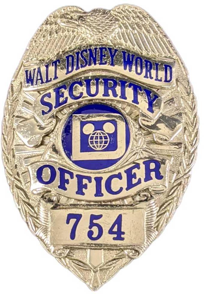 Early 1980s Disney World Security Metal Badge: Early 1980s Disney World Security Metal Badge. Is approx 2 1/4" x 3/4" x 3" and it weighs under one pound at 0.16lb. The metal badge is in a good, vintage condition with some wear and mini scratches a