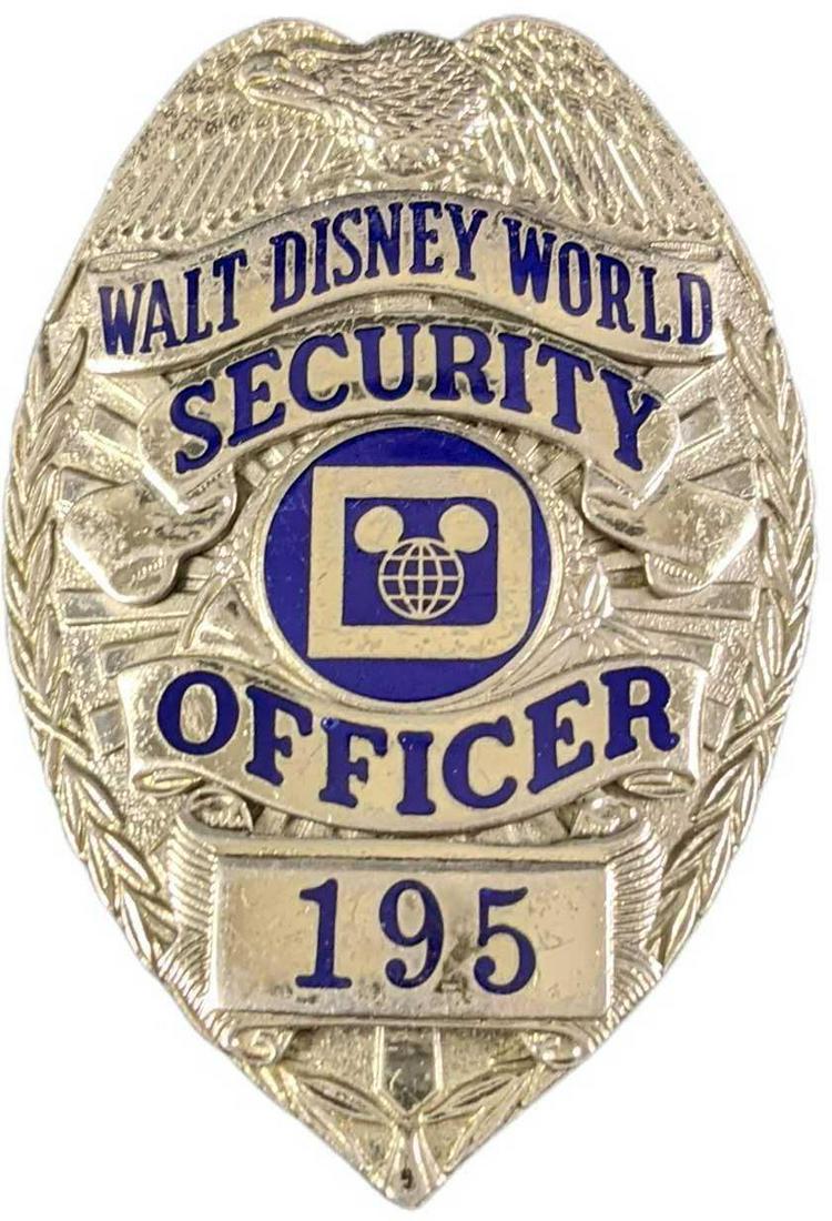 Early 1980s Disney World Security Metal Badge: Early 1980s Disney World Security Metal Badge. Is approx 2 1/4" x 3/4" x 3" and it weighs under one pound at 0.16lb. The metal badge is in a good, vintage condition with some wear and mini scratches a