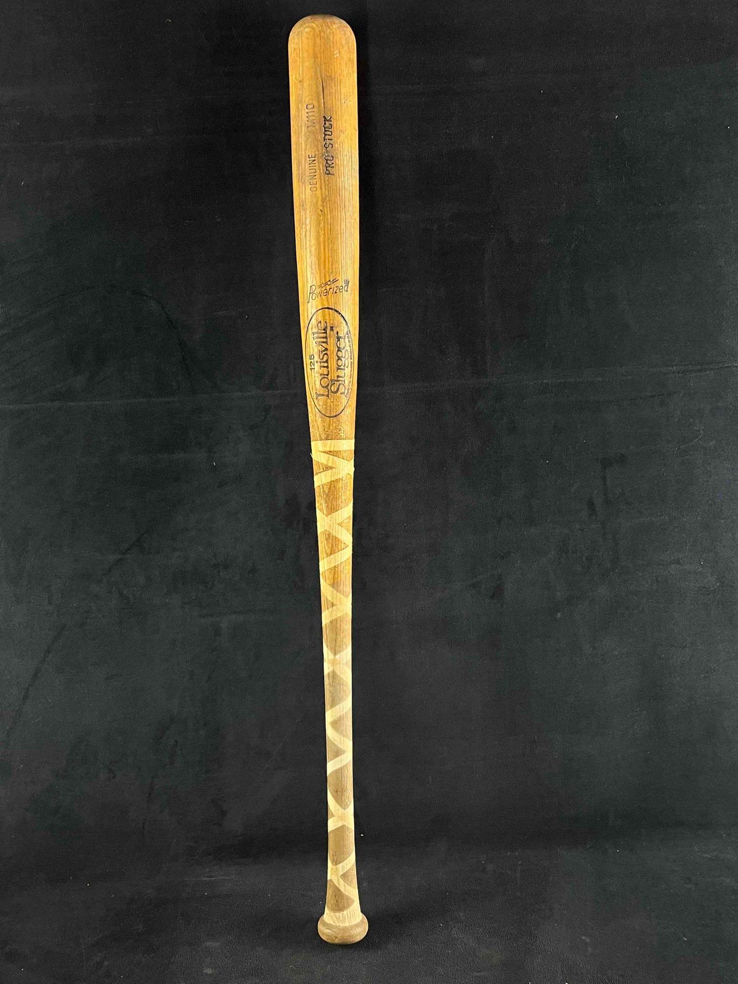 Louisville Slugger 125 Wood Bat Model M110 Pro Stock: Louisville Slugger 125 Wood Bat Model M110 Pro Stock This is a vintage Louisville Slugger bat. This bat is in vintage condition, it has some splintering on the bat. There used to be wrapping on the ha