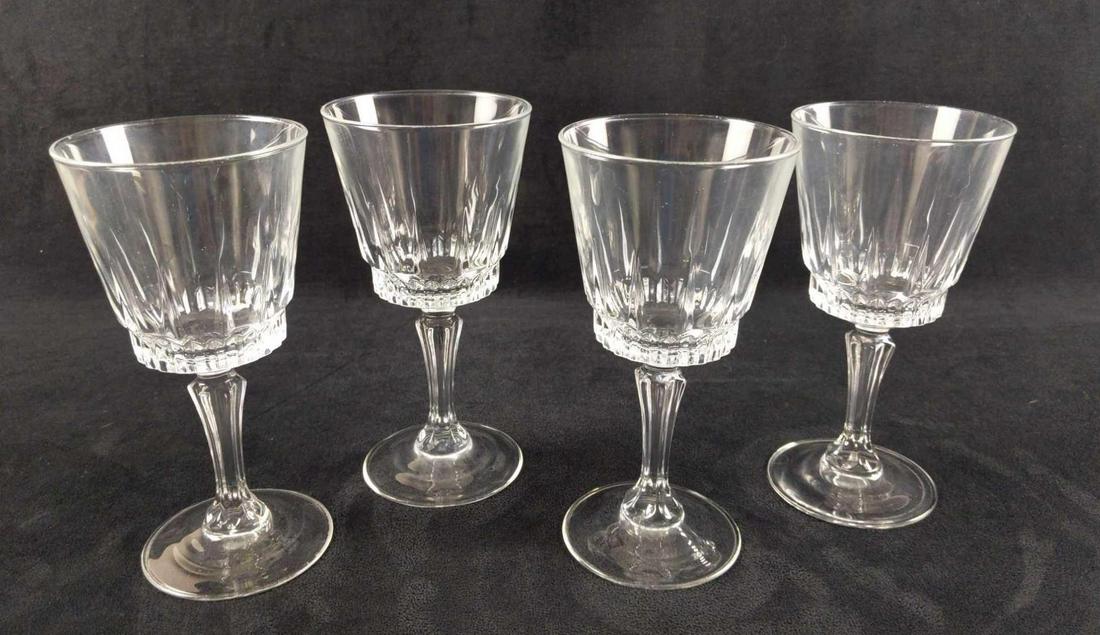 Four Stemmed Glass Water Wine Goblets: Four Stemmed Glass Water Wine Goblets. The maker and date of creation are unknown. Goblets are approx 3 1/2" x 3 1/2" x 7 1/8". Goblets are in good, used condition with no known damage.