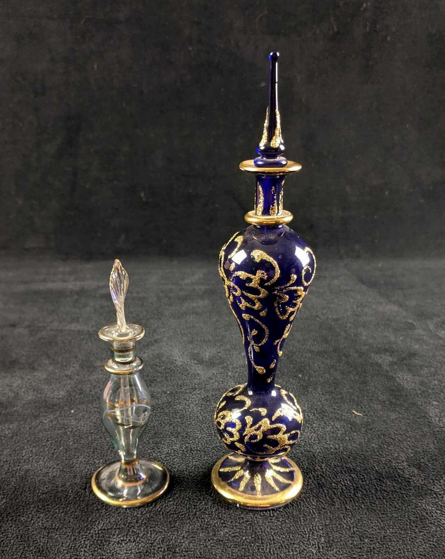 Glass Vase Perfume Flask Egyptian Perfume Bottles: Glass Vase Perfume Flask Egyptian Perfume Bottles This lot comes with two glass Egyptian perfume bottles. These bottles do not contain any liquid. These make for beautiful decor or you can fill them w