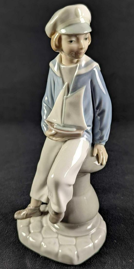 Lladro Little Boy With Boat Porcelain Figurine (0863) on May 08, 2022 Rapid Estate