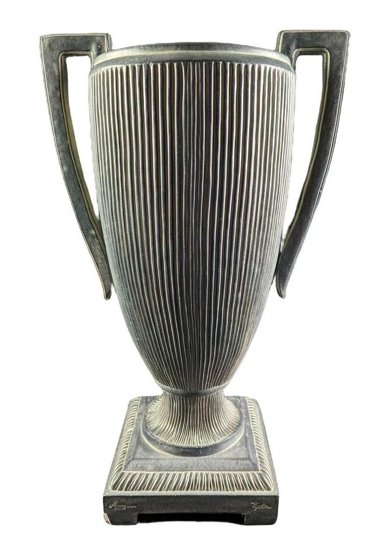 Austin Sculptures Twin Handled Trophy Vase: Austin Sculptures Twin Handled Trophy Vase. This is made of what the company called "Durastone", which is hand cast and hand finished. Durastone is a special formulation of crushed stone mixed in a sl