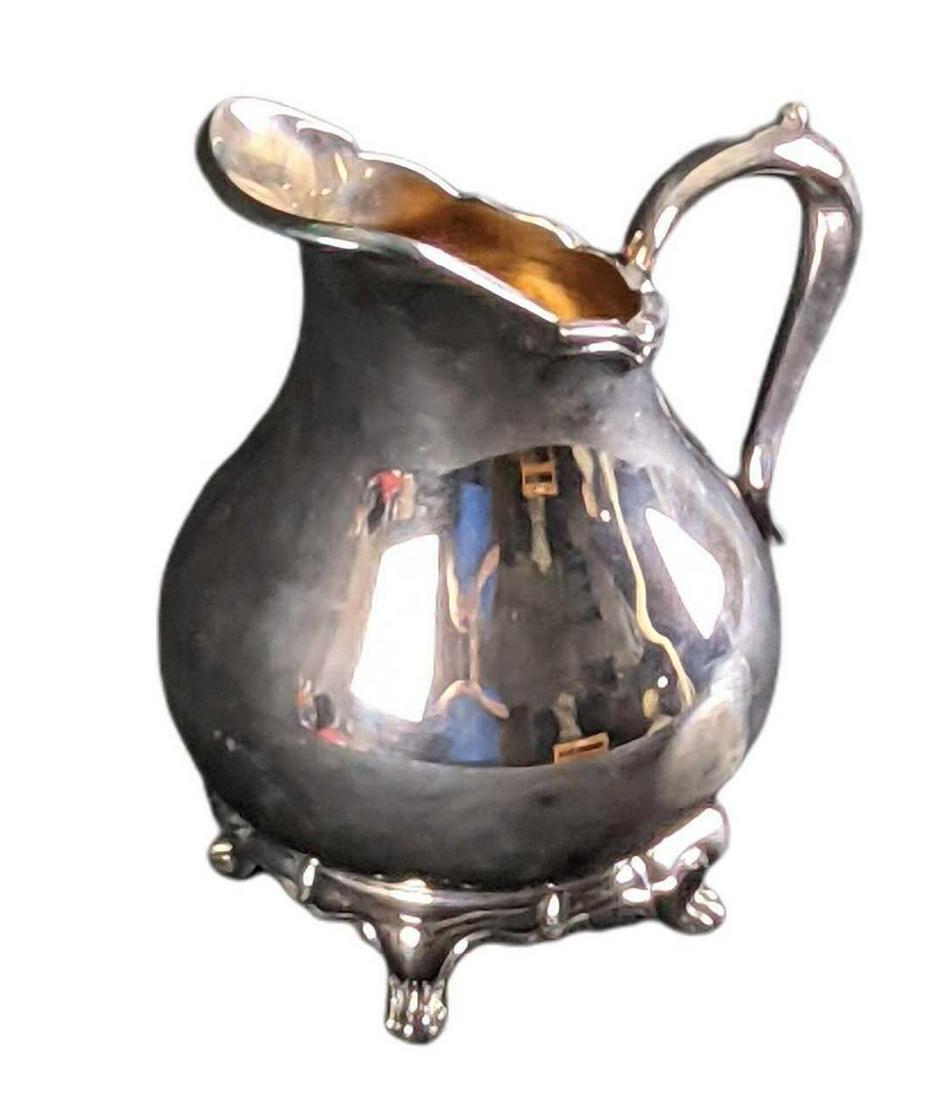 Reed & Barton Provincial Silverplate Creamer: Reed & Barton Provincial Silverplate Creamer. The creamer is approx 5" x 4" x 6" and weighs 1.42lb. The creamer is in a good, used condition with some wear, light surface tarnish, and petite scratches