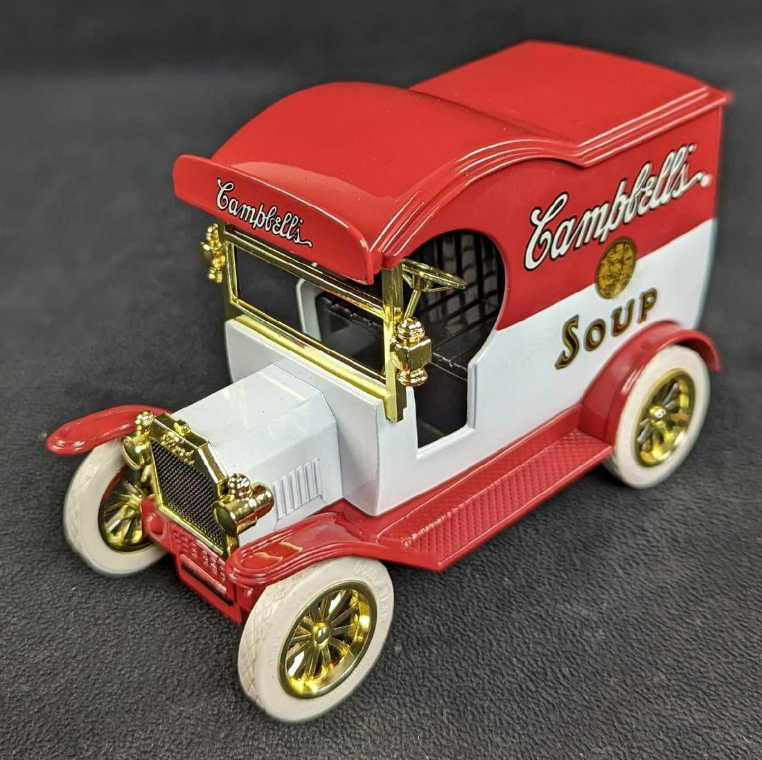 1912 Ford Model T Campbell's Soup Car Bank: 1912 Ford Model T Campbell's Soup Die Cast Delivery Car/Bank by Gearbox. The car/bank is approx 5 1/2" x 2 1/2" x 3 1/4". It comes in its original box which is approx 8" x 4" x 5 1/2" and it weighs 1.