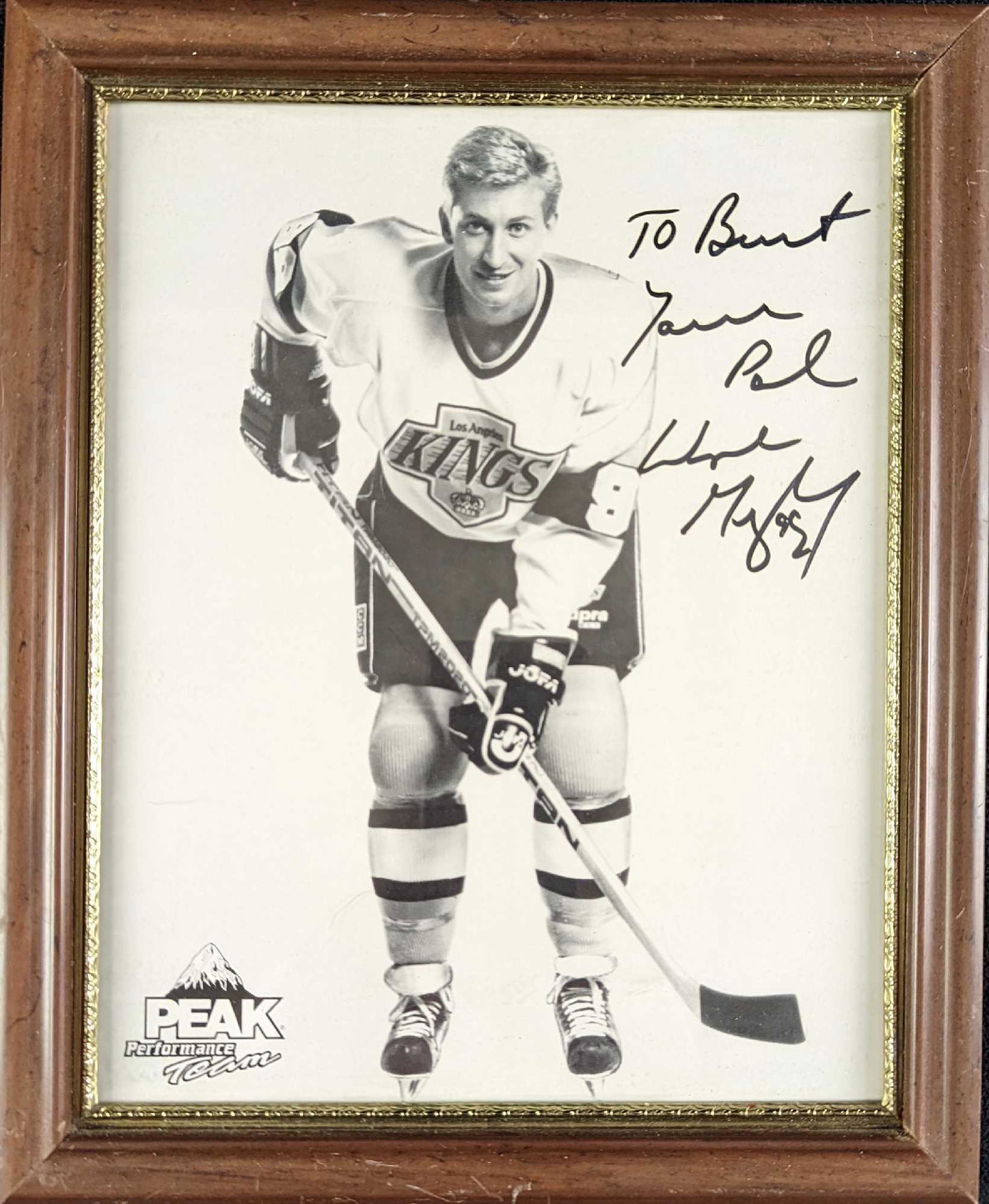 Autographed Wayne Gretzky Hockey Photo Peak Performance: Here is a framed autographed photo of hockey great, Wayne Gretzky. This photo was dedicated to its original owner and autographed by Wayne Gretzky on the top right of the photo. The framed photo is ap