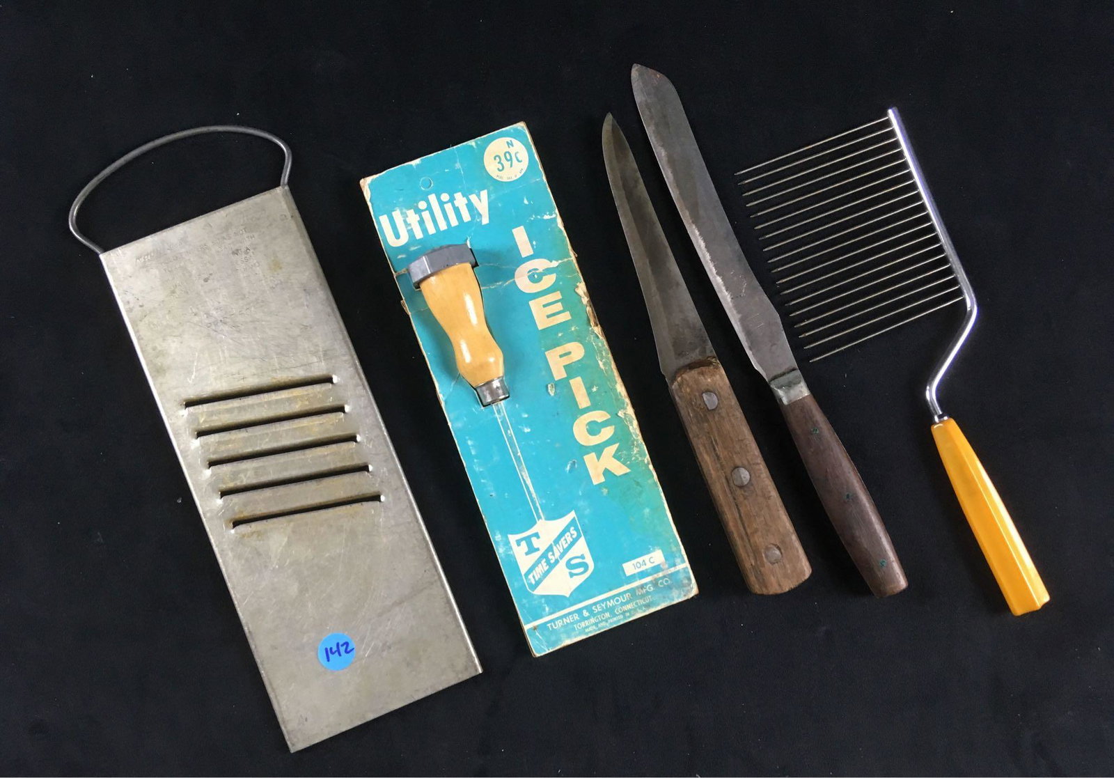 Lot of 5 Vintage Kitchen Utensils: Lot of 5 Vintage Kitchen Utensils; lot includes 1) Bluffton Co. Slaw Cutter, in very good condition measures 4 1/4" W x 13" L, 2) cake breaker showing a gold tone Bakelite handle, in excellent conditi