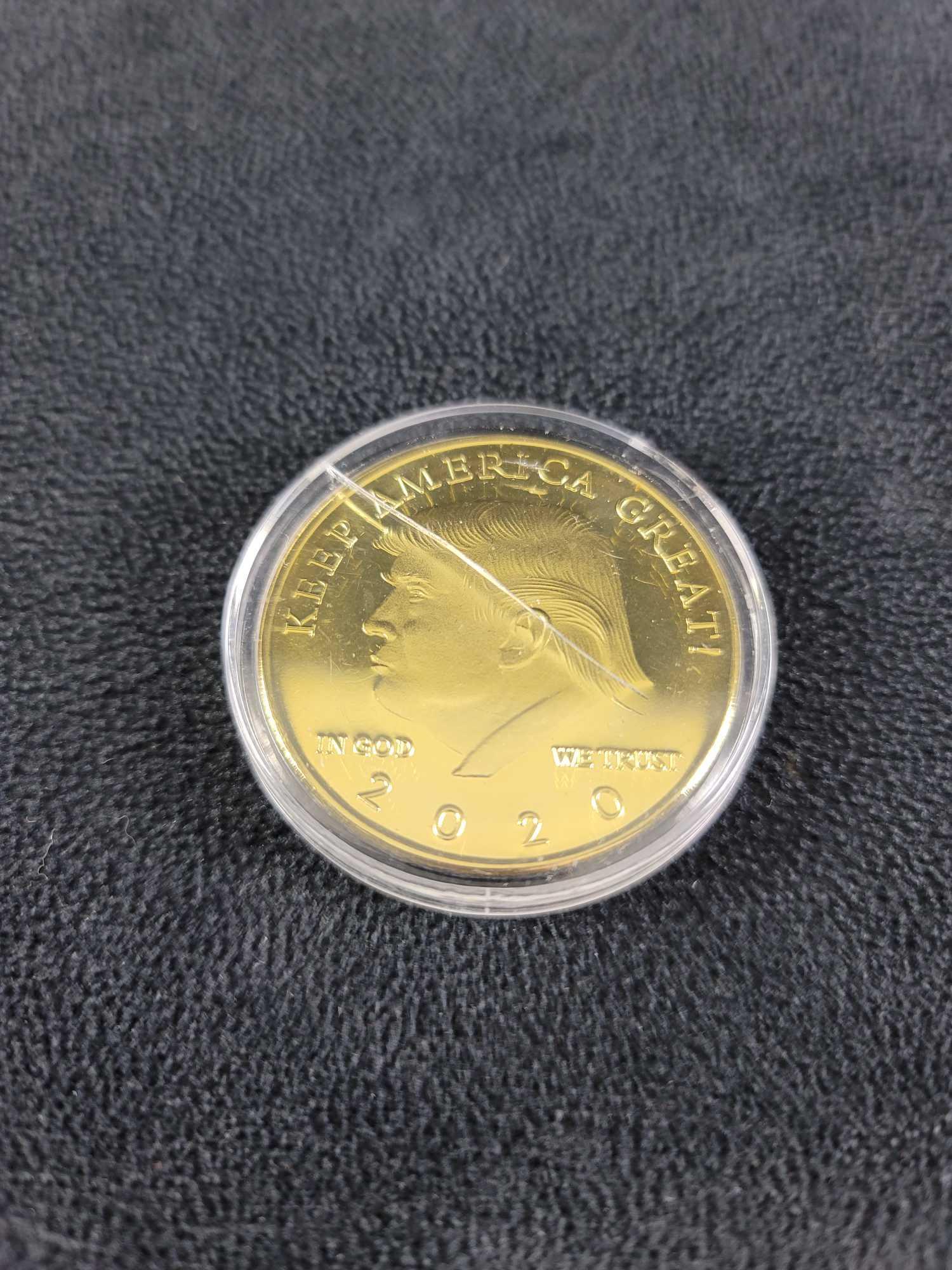 Donald Trump Gold Plated Collectable Coin: Donald Trump Gold Plated Collectable Coin With Case. Is in a good, used condition with no known damage on the coin. There is a crack in the case. Approx. measures 1 3/4" x 1 3/4", weight is .064 lbs