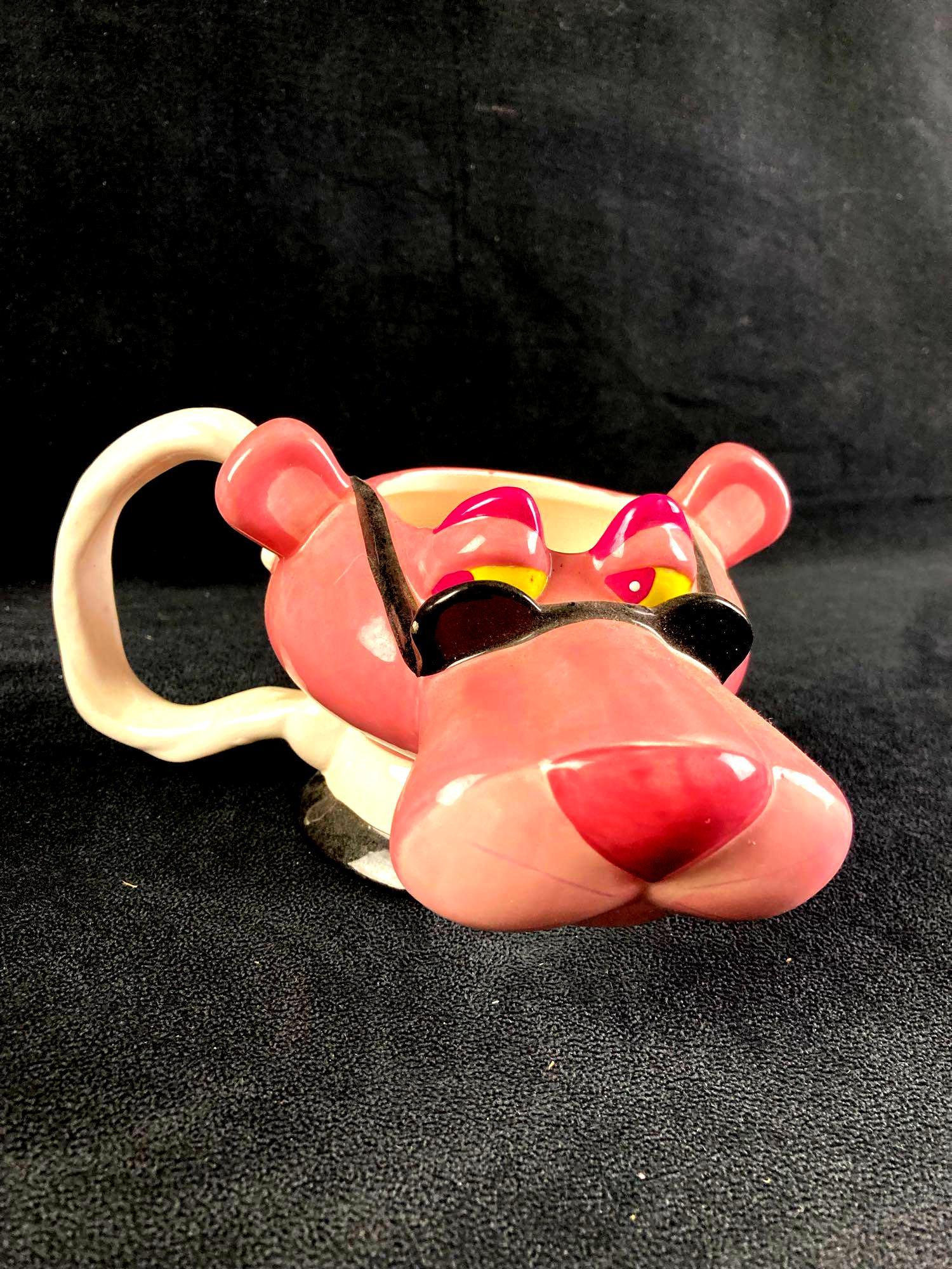 Pink Panther Glass Mug: Up for auction is a recent estate find, a glass Pink Panther Mug. The mug was made in 1999 and shows the Pink Panther wearing sunglasses. This auction includes: (1) Glass Pink Panther Mug Condition is