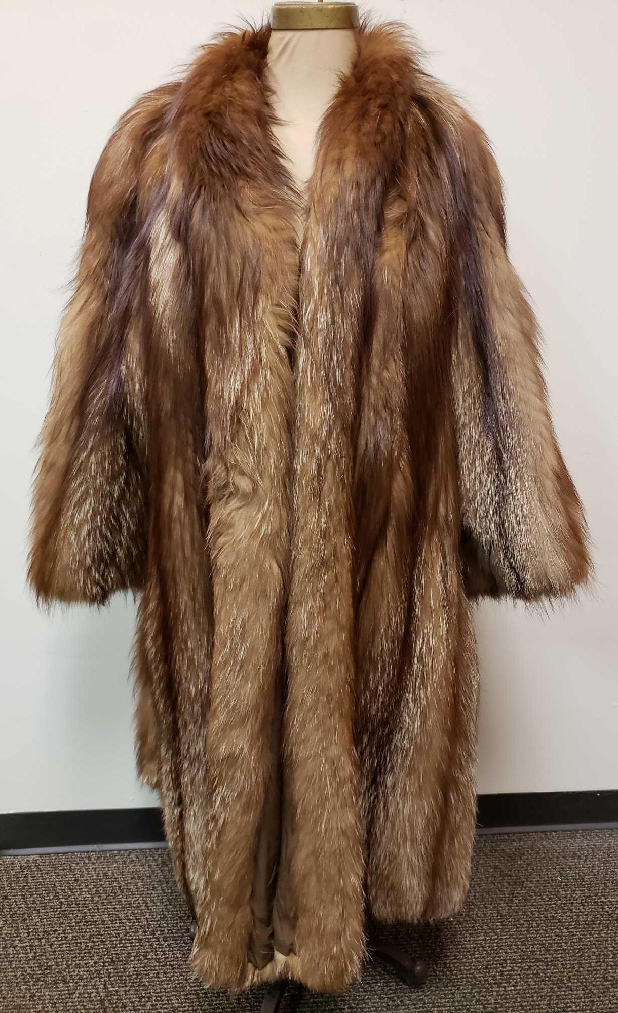 Borello Torino Gold Cross Fox Fur Coat: Borello Torino Gold Cross Fox Fur Coat. This fur coat is in great used condition. The coat has no known damage to the interior or exterior. The coat has a brown fabric interior and an interior pocket