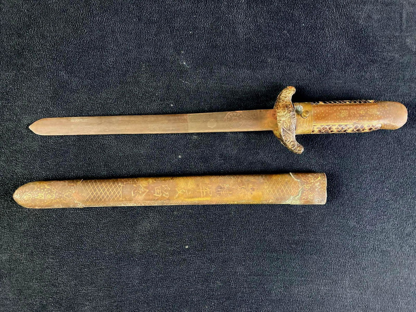 Republic of China Military Academy Graduation Dagger Circa Post 1949: Up for auction is a Republic of China Military Academy Graduation Dagger fresh from a recent estate. It has the ROC flag stamped on the blade with the phrase "spirit of the army" and the hilt is wrapp