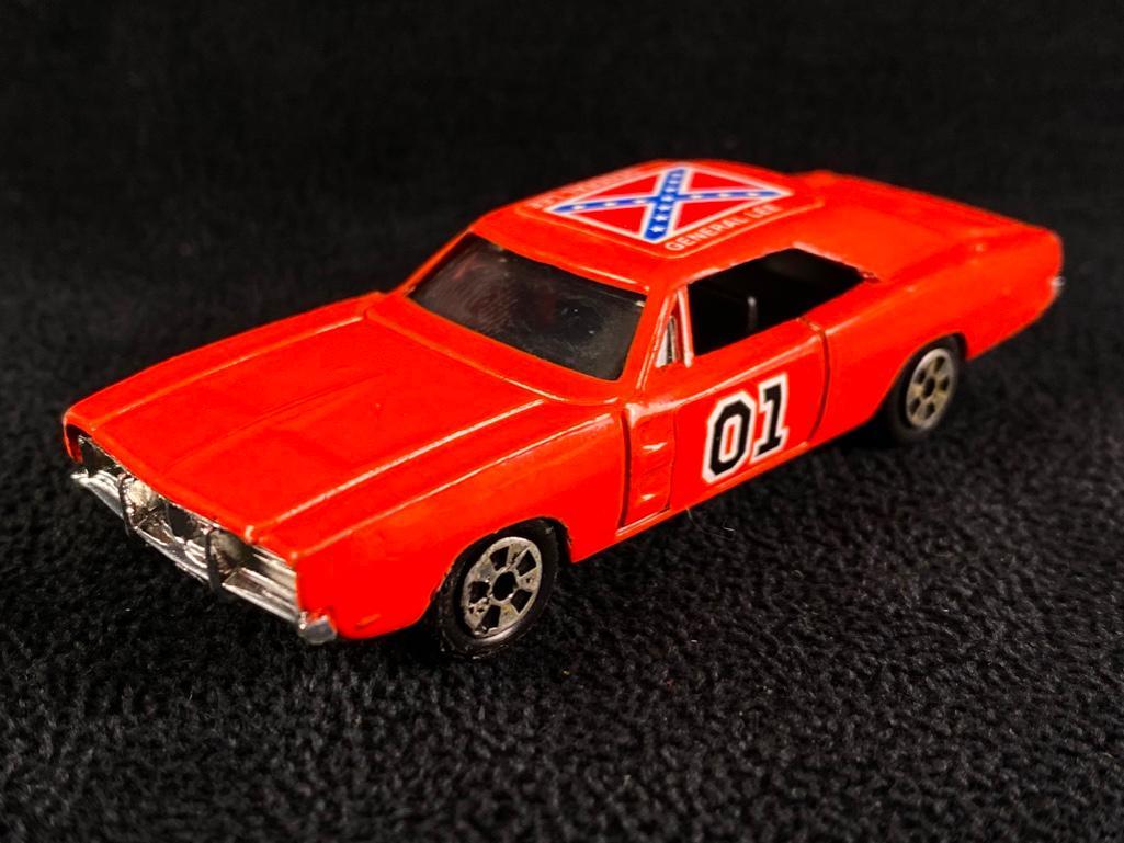 Early 1980s Dukes of Hazzard General Lee Ertl: Early 1980s Dukes of Hazzard General Lee Ertl Vintage General Lee Dodge Charger from the Dukes of Hazzard, made by Ertl, dated 1981. This 1/64 scale die cast car is in excellent condition with very li