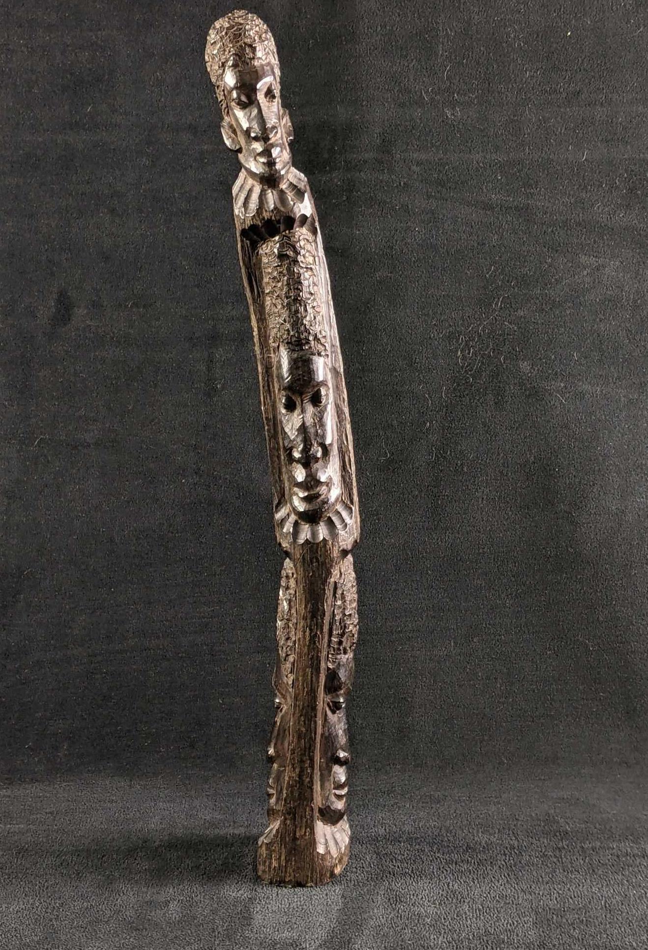 Wooden Totem African Style Wood Carved Totem: Wooden Totem African Style Wood Carved Totem This totem is wood-carved most likely from ebony. This totem has no major damage just a few scuffs. The totem seems to be made to curve to one side. This i