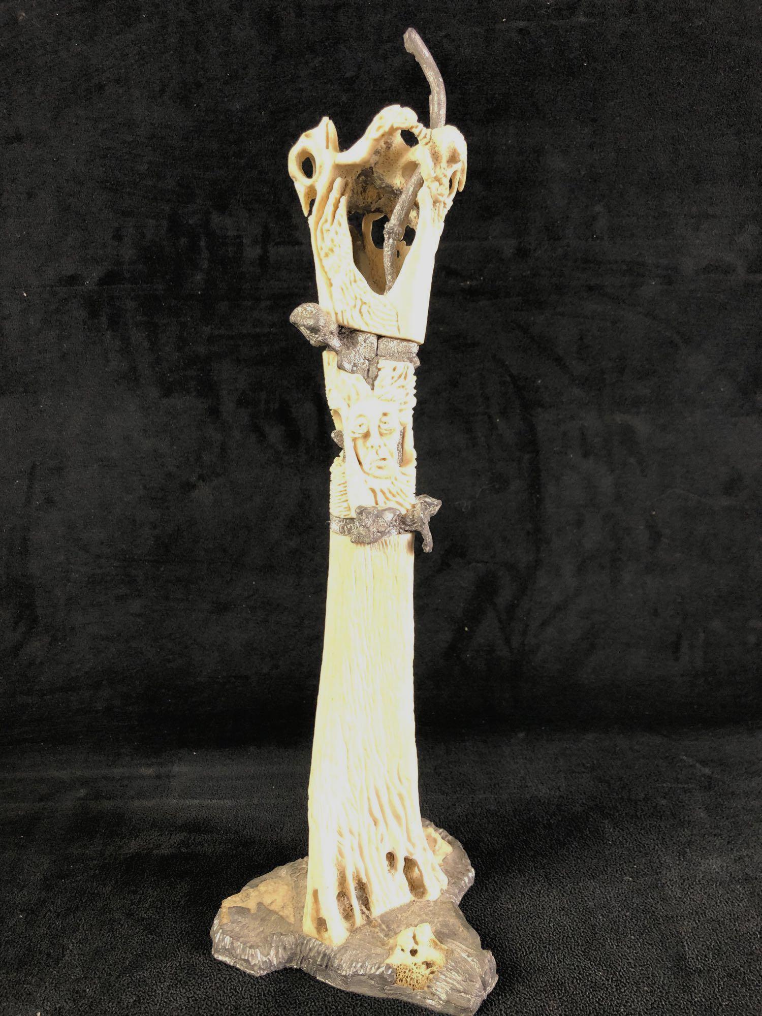 Cuban Art Lower Cow Leg Bone Tree Motif: Cuban artistic depiction of tree carved from a cow bone. Filled with decorative pewter through the middle of the bone and at the base. This auction includes: (1) Cuban Decorative Cow Bone Carved Tree