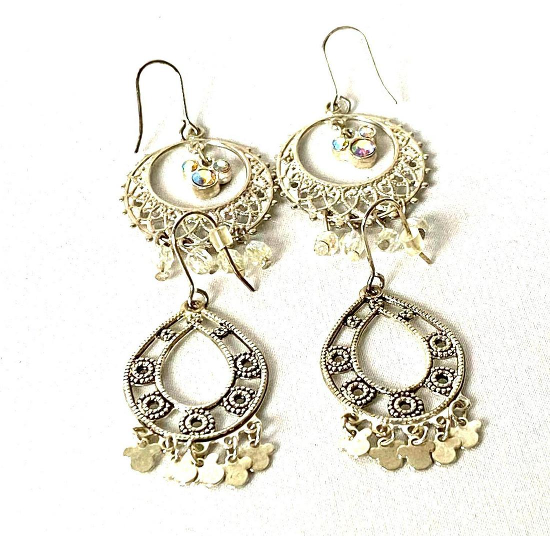 Authentic Disney Silver Plated Chandelier Earrings: All pieces are tested and researched prior to listing . Please view all our pictures they are part of our description . Happy Bidding DETAILS: Material : Silver Plated Maker : Disney Stones : Rhinesto