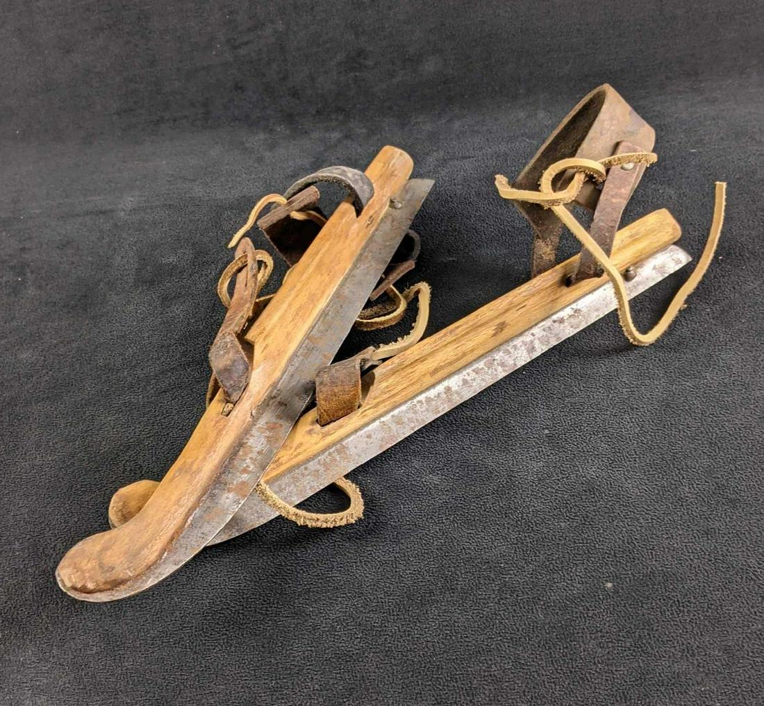 Antique Ice Skates Old Ice Shoes: Antique Ice Skates Old Ice Shoes These are antique ice skates made from wood with metal blades on the bottom and leather straps to strap on to existing regular shoes. These blades would have been shar