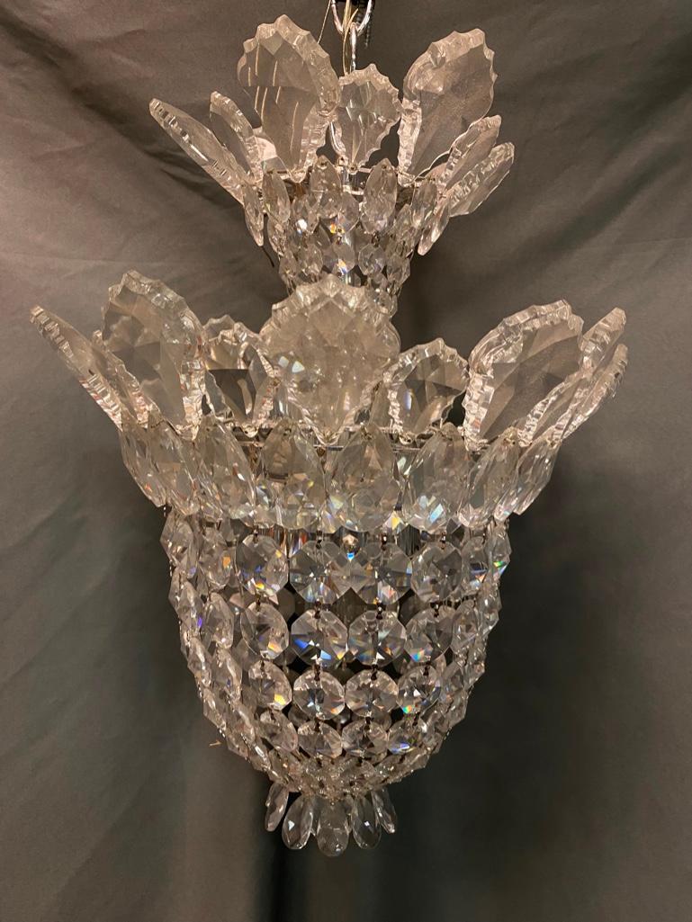 Schonbek Trilliane 12.5" Pendant Light: Schonbek Trilliane 12.5" Pendant Light Trilliane 12.5" small chandelier by Schonbek, made with Swarovski crystal. The metal pieces are silver in color, and the piece comes in a silver color chain. It 