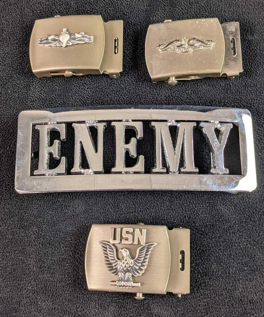 Lot Of Four Metal Belt Buckles: This lot includes: (1) Reflective ENEMY Belt Buckle. (1) Navy Ships Belt Buckle. (1) USN (United States Navy) Eagle Belt Buckle. (1) Fish And Navy Ship Belt Buckle. Belt Buckles are in a good, unused 