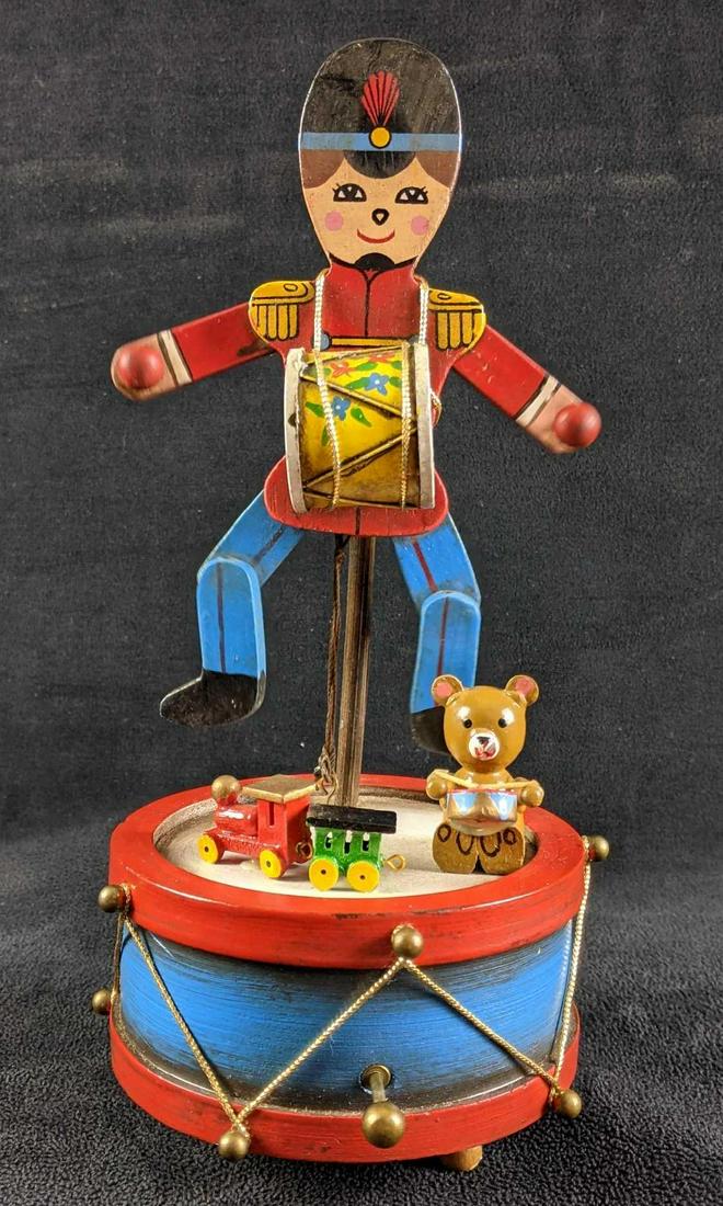 Christmas Soldier and Toy Music Box: Christmas Soldier and Toy Music Box This is a Christmas Soldier and toy music box. The music box is in good condition and is a cute wooden decoration of a drummer drumming with other toys. The music b