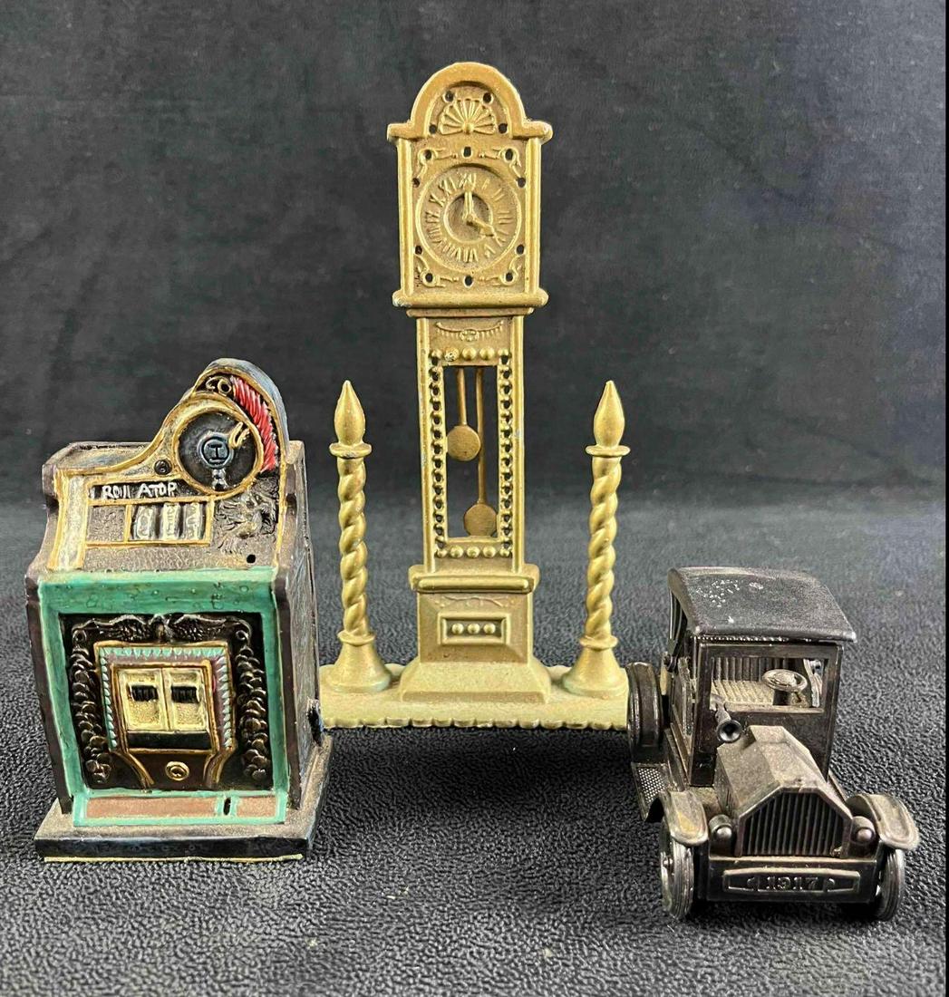 Vintage Item Figurines: Vintage Item Figurines 1) Metal Tall Clock. The metal is a bit scuffed and has developed a patina over time, otherwise in good used condition. Measures 6.5" x 4" x 1.5". 1) Vintage slot machine miniat
