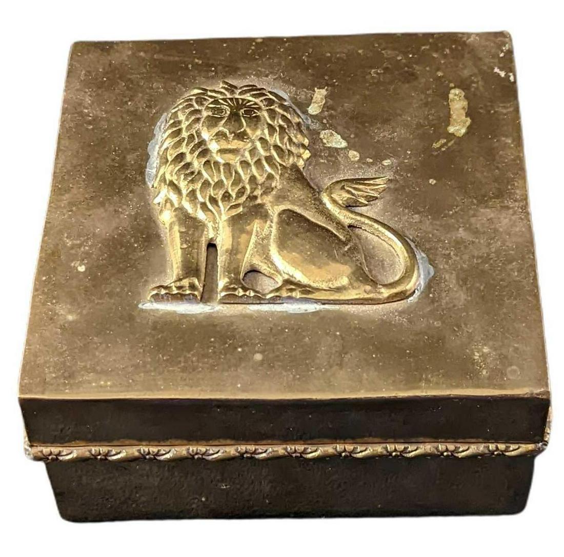 Vintage 1980 Proud Lion Brass Trinket Jewelry Box: Brass trinket box from India with a 'Proud Lion' on the cover. Box is approx 5 1/2" x 5 1/2" x 2 1/2" and it weighs 1.37lb. The box is in good, vintage condition with light tarnish and light glue resi