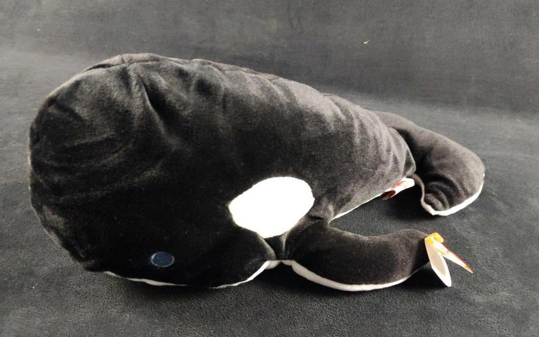 Ty Tide The Killer Whale Beanie Buddies Orca A: "Tide" the Orca from Ty's Pillow Pal Collection. Pillow Pal is approx 9" x 14" x 6". Is in good, unused condition with only some price sticker residue on the inside of the TY tag.