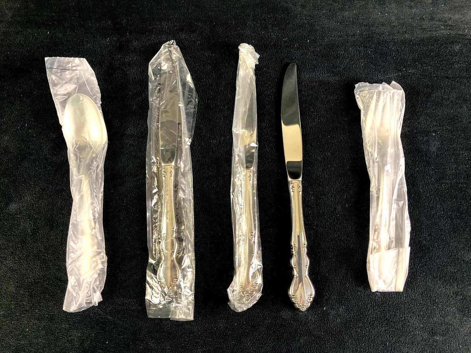 Silver Dining Set Estate Fresh: Up for auction is a recent estate find, a set of (5) dining silverware pieces. There are three knives, one fork, and one spoon. All of them are in plastic wrapping for the exception of one knife. This