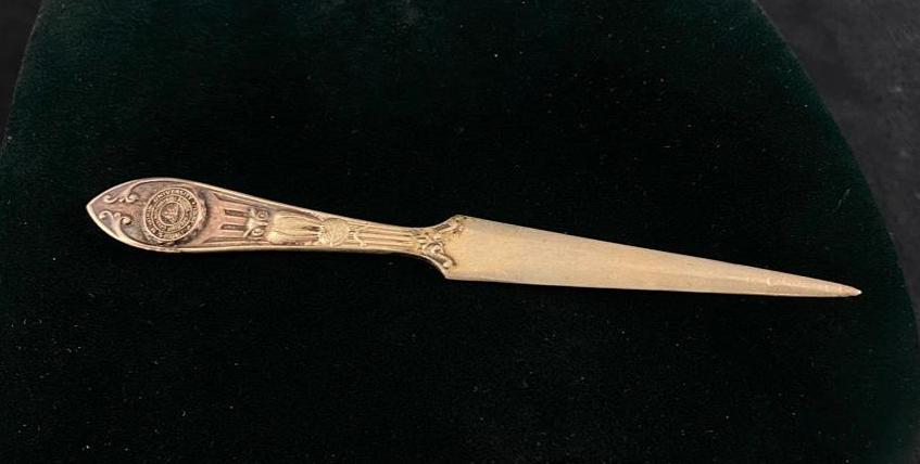 Antique Millikin University Silver Letter Opener: Antique Millikin University Silver Letter Opener This antique silver-plated letter opener is adorned with the seal of Millikin University in Decatur, Illinois. Believed to date back to a 1922 dinner p