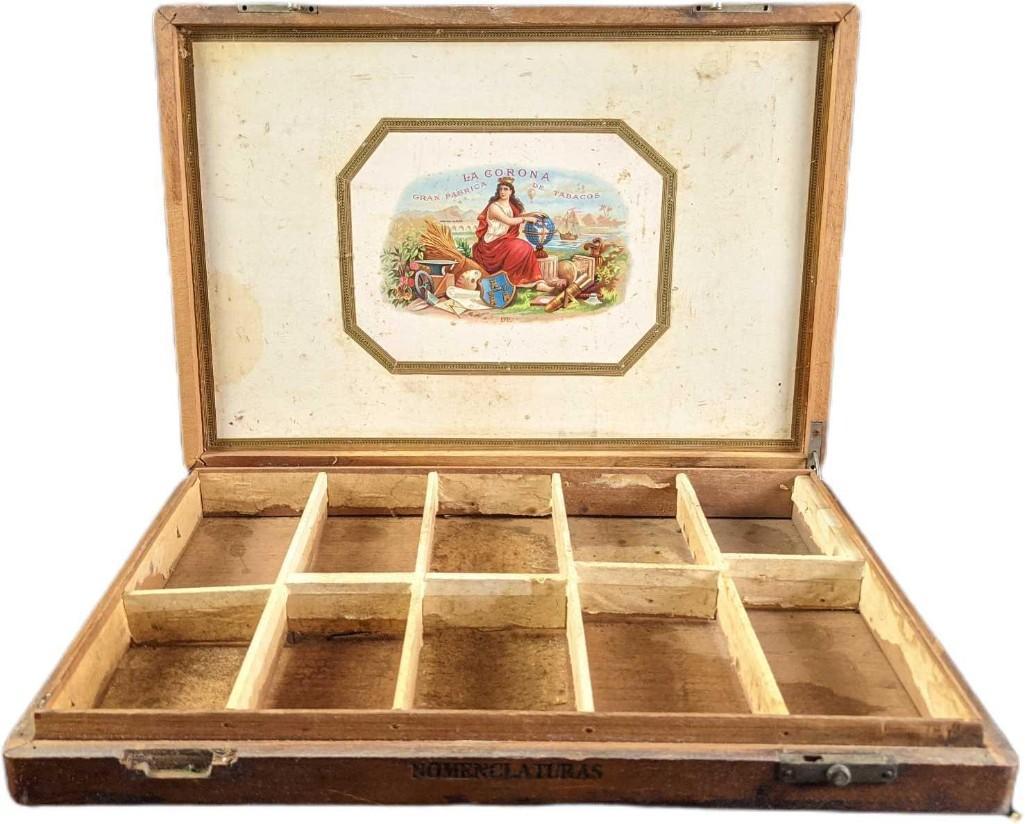 Vintage Corona Nomenclaturas Wooden Cigar Box: Vintage Corona Nomenclaturas Wooden Cigar Box. Is approx 17" x 2" x 12" and it weighs 2.32lb. The box is in a good, vintage condition with wear, discoloration on the inside graphic, and one of the loc