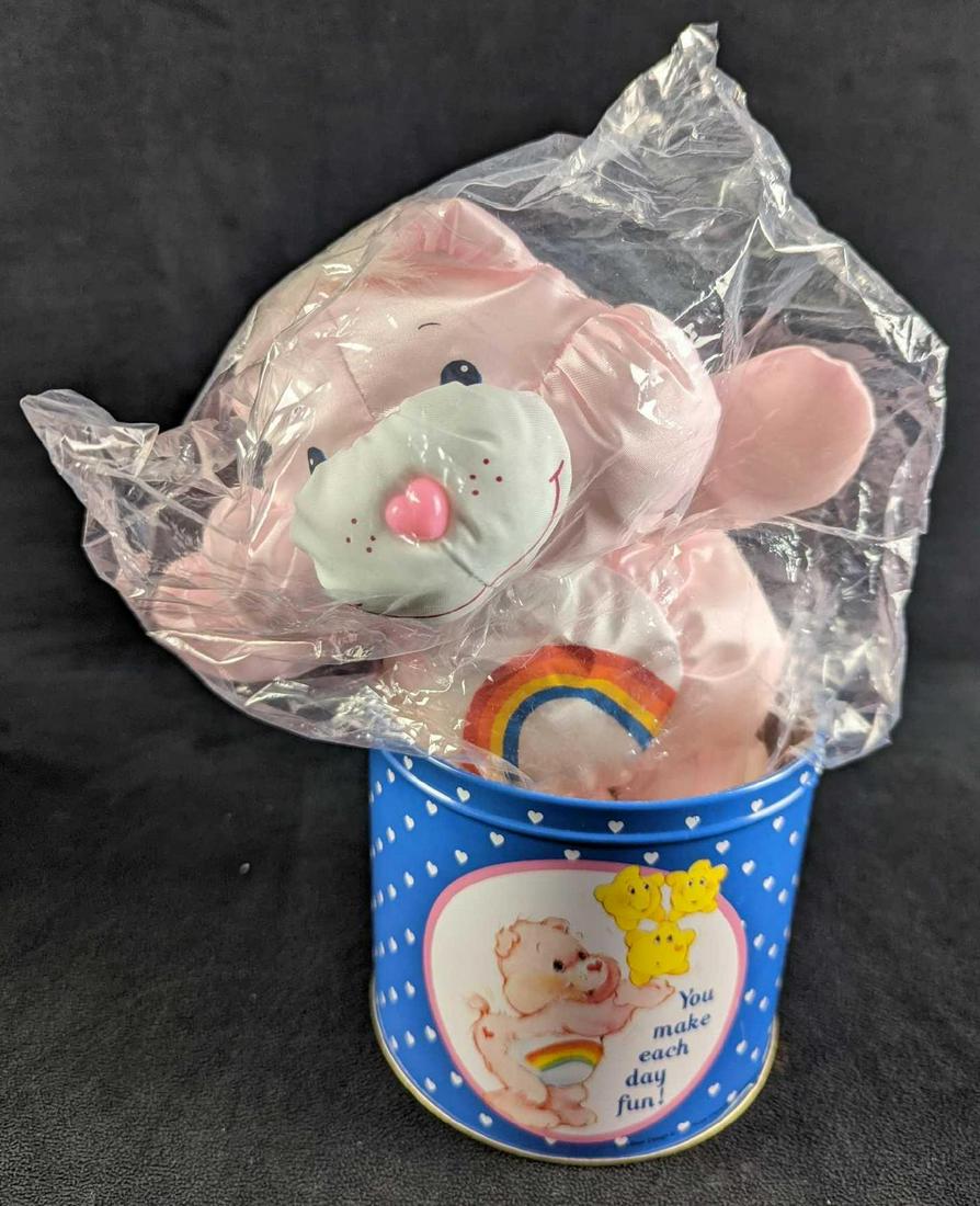 Vintage Rare Care Bear Tin With Cheer Bear Doll: Vintage Rare Care Bear Tin With Cheer Bear Doll. "Cheer Bear" is still in its wrapping. Both the tin and bear come in its original box which is approx 6" x 5 3/4" x 5 3/4" and it weighs 0.95lb. Both t