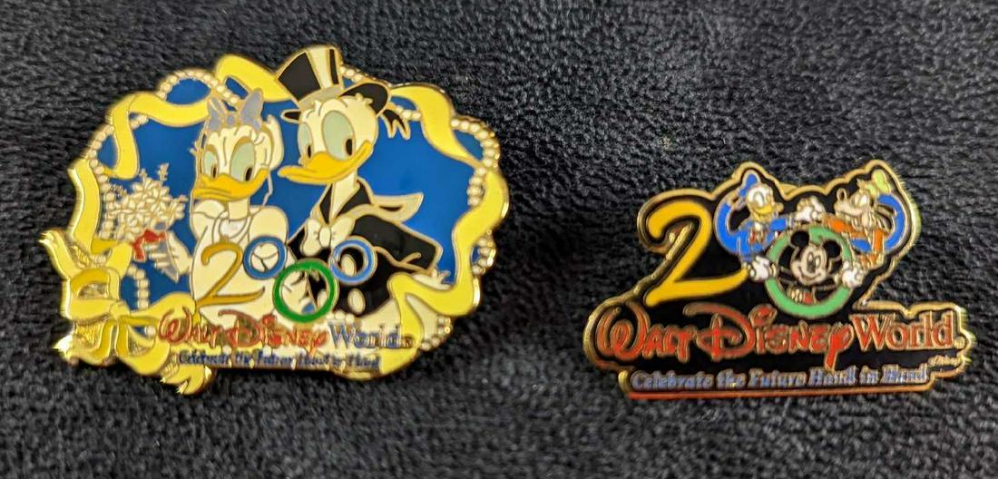 Two Walt Disney World Donald Duck Pins Y2K: Two Walt Disney World Donald Duck Pins Y2K This lot consists of: (1) Donald & Daisy Duck Wedding Year 2000 Pin. This is approx 1 3/4" x 1 1/4" (1) 2000 Walt Disney World "Celebrate The Future Hand To