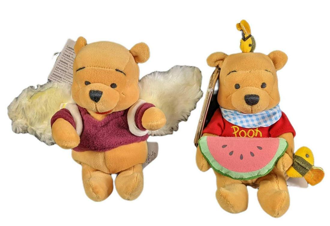 2 Disney Winnie The Pooh Bean Bag Dolls Wings Summer Fun: It's Winnie The Pooh, times two! Would you spend time with Pooh as he would like it too! This hunny of a lot includes: (1) Pooh Dreams With Wings. UK Exclusive! (1) Summer Fun. Pooh With Bees and wate