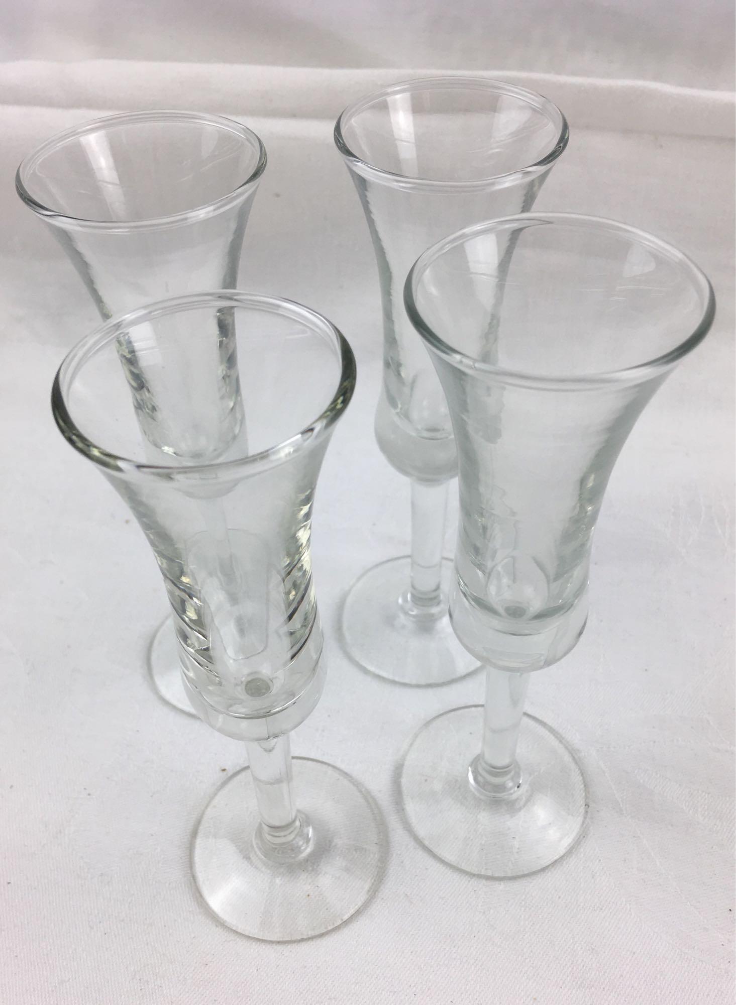 Set of 4 Stemmed Cordial/Sherry Glasses, by Libby: Set of 4 Stemmed Cordial/Sherry Glasses, by Libby; a very nice set of 4 stemmed glasses. Each shows a mark on the base that appears as a feather. These glasses are in excellent condition, each measure