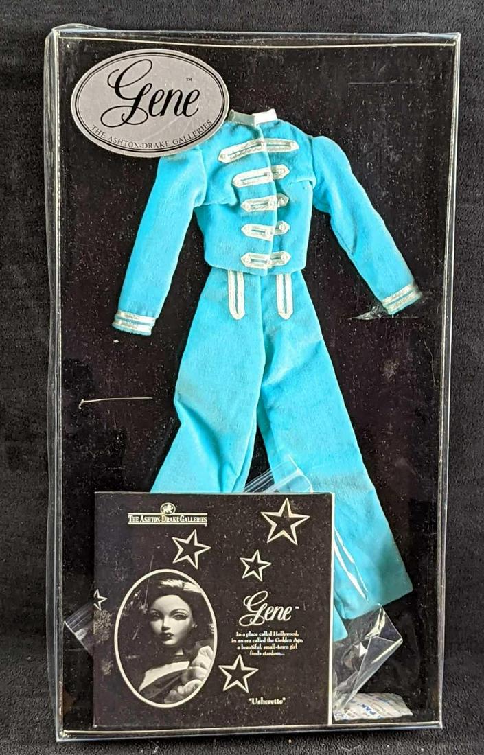 16â€ Ashton Drake Gene Usherette Uniform: 16” Ashton Drake Gene Usherette Uniform. The clothing box comes in a protective cardboard box that is approx 9 5/8" x 2" x 17" and it weighs 0.90lb. There is some light shelf wear on the box and