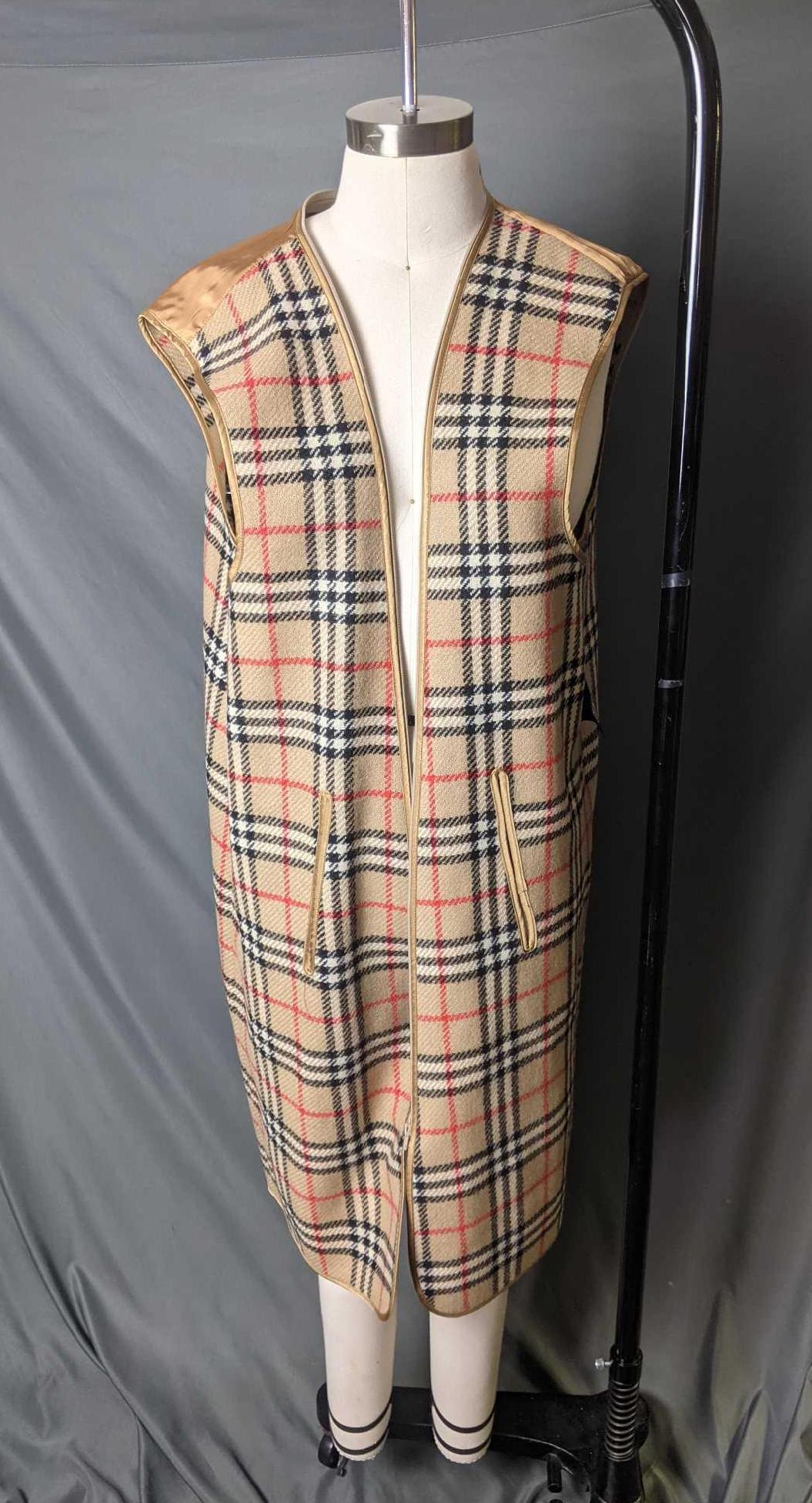 Vintage Burberry's Made in England Harrods Vest: Vintage Burberry's Made in England Harrods Vest This vest is a wool coat liner vest for really cold days. It is a 100% wool men's vest. The only flaw is that its zipper won't zip up due to a missing z