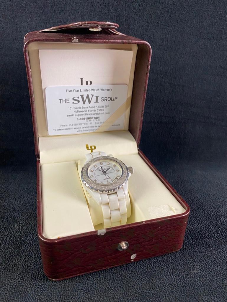 Lucien Piccard White Ceramic & Crystal Bezel Watch: Lucien Piccard White Ceramic & Crystal Bezel Watch Model 28008 Lucien Piccard women's watch with white ceramic bracelet and crystal on the bezel and face. Comes with the original box and paperwork, an