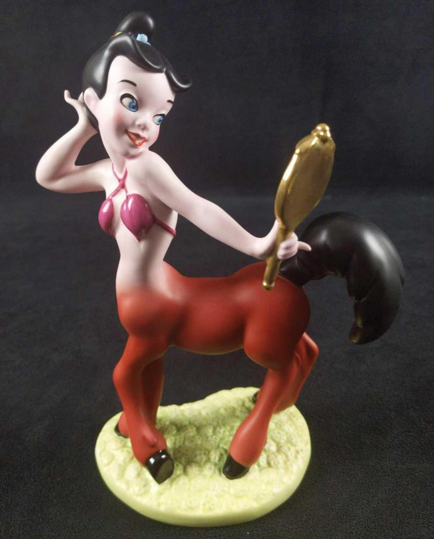 Disney Fantasia Romantic Reflections Centaur Figurine: Retired Disney's Fantasia "Romantic Reflections" Centaur Porcelain Figurine. Part of the "Fantasia" line by Walt Disney's Classic Collection. Figurine is approx 4" x 3" x 7 1/2". Comes in original box