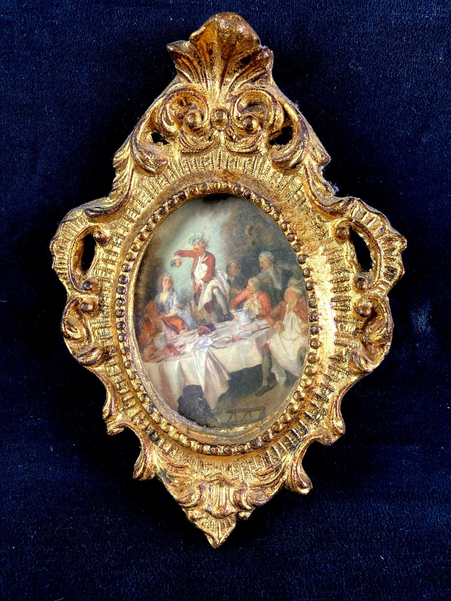 Small English Decorative Painting Copy Wall Mount: Up for auction is an English portrait inside a decorative frame. The frame is painted gold and the frame is made of a sort of plexiglass. It is meant to be mounted on a wall. This auction includes: (1