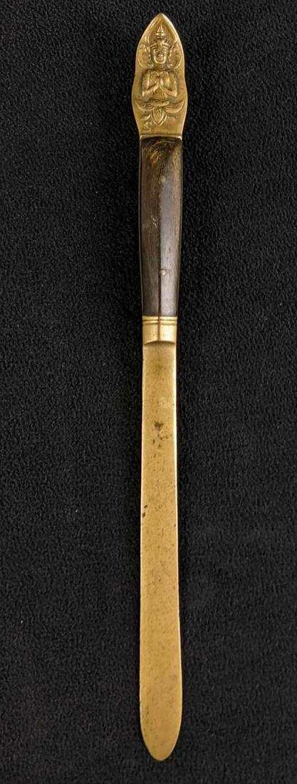 Vintage Brass Letter Opener Wood Handle: Vintage Brass Letter Opener Wood Handle This letter opener in great condition. It has some wear from the use of the handle. It is such a beautiful unique piece. We believe the figure on the handle is 