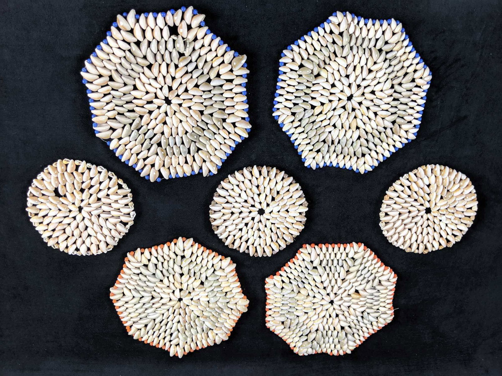 Vintage Boho Cowrie Sea Shell Art Trivets: This is a collection of seven fun old Florida-style sea shell trivets. Each is made from Cowrie Sea Shells. The larger trivet is approx 9"x9" while the smaller ones are approx 6"x6". Together they wei