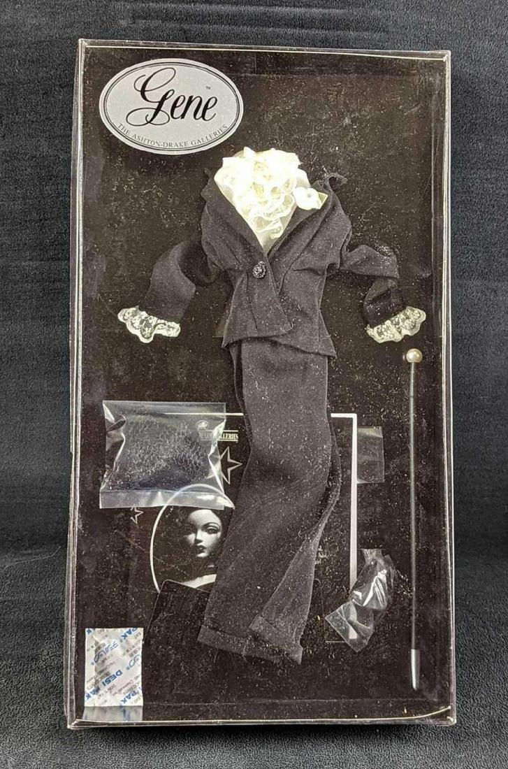 16â€ Ashton Drake Gene Blonde Lace Outfit: 16” Ashton Drake Gene "Blonde Lace" Outfit. The clothing box comes in a protective cardboard box that is approx 9 1/2" x 2" x 17" and it weighs 0.84lb. There is some light shelf wear on the box 
