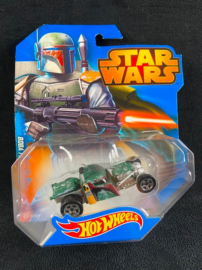 Boba Fett Hot Wheels Star Wars Car New in Box: Boba Fett Hot Wheels Star Wars Car New in Box Special edition Star Wars Hot Wheels hot rod, featuring Boba Fett. In good condition, in the original unopened packaging. From the 2014 series. Approximat