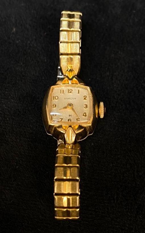 10k Rolled Gold Ladies Hamilton Wristwatch 1950s: 10k Rolled Gold Ladies Hamilton Wristwatch 1950s DETAILS: Metal - 10k rolled gold plate Color - gold Tested - Yes Size - 16mm x 28mm Weight - 15 g Markings - 10k RGP Maker - Hamilton Stones - none Sty
