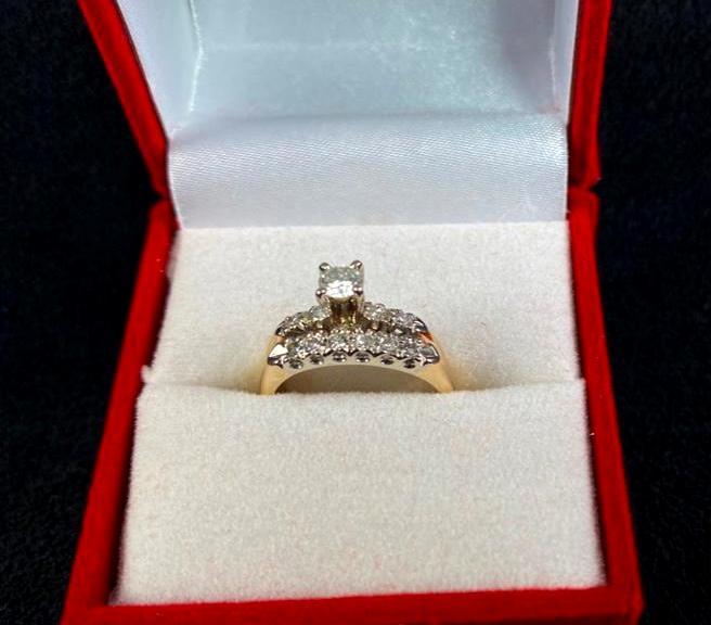 Diamond Engagement Ring & Wedding Band: Diamond Engagement Ring & Wedding Band 14k yellow gold and diamond engagement ring fused with wedding band. The 3.9g ring features a single stone surrounded by 4 melee diamonds on the engagement band,