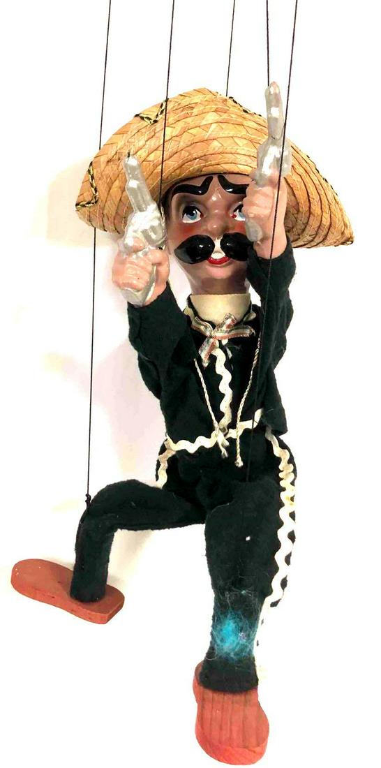 Vintage Pancho Villa Marionette Mexican Bandit String Puppet: This lot contains a vintage Pancho Villa marionette Mexican bandit string puppet with pistols. This retro toy was made out of wood, felt, straw and string in Mexico. It is the perfect addition to any 