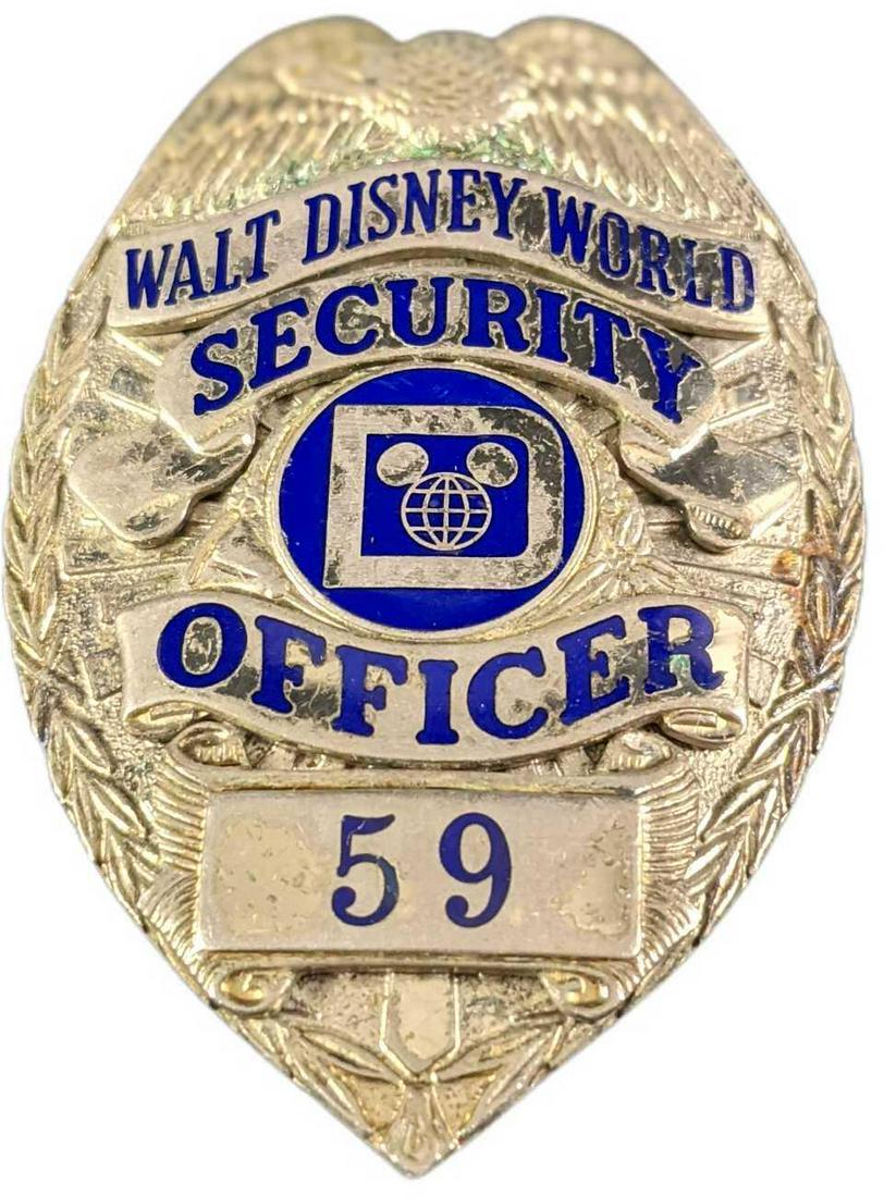 Early 1980s Disney World Security Metal Badge: Early 1980s Disney World Security Metal Badge. Is approx 2 1/4" x 3/4" x 3" and it weighs under one pound at 0.16lb. The metal badge is in a good, vintage condition with some wear, markings and mini s